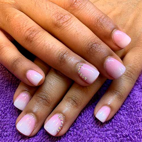 Cute short acrylics pink and white ombre short gel nails with rhinestones