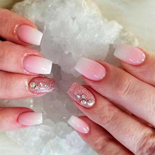 Cute short acrylic nails coffin shaped with accent glitter nail adorned with crystals