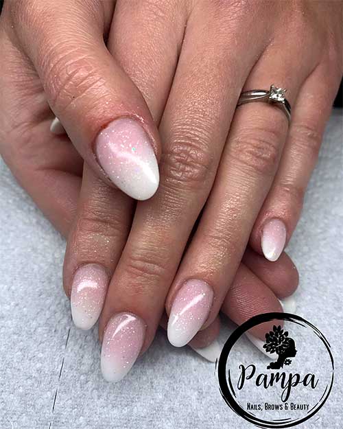 Stunning pink and white ombre short almond shaped nails 2020 with glitter