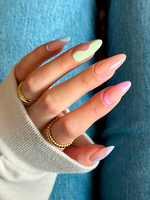 Long almond-shaped pastel multicolor nails 2023 over nude base color