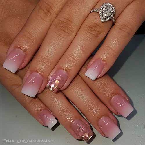 Pink and white ombre nails short with glitter on an accent nail