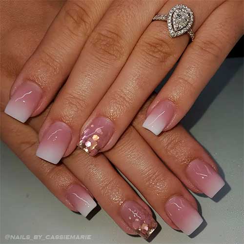 Pink and white ombre nails short with glitter on an accent nail Pink and white ombre nails short with glitter on an accent nail