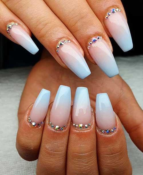 Cute baby blue ombre acrylic nails with rhinestones!