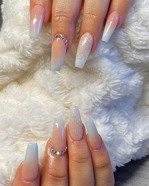 Cute baby blue ombre nails with accent glitter coffin shaped and rhinestones design
