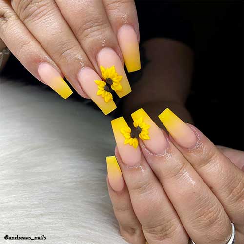 Cute coffin shaped yellow ombre matte nails with sunflower