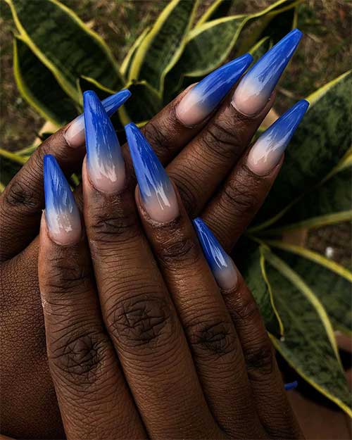 Cute royal blue ombre nails coffin shaped on dark skin hands