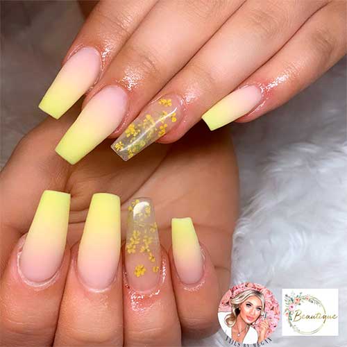 Cute yellow ombre matte nails coffin shaped with accent encapsulated flower nail art
