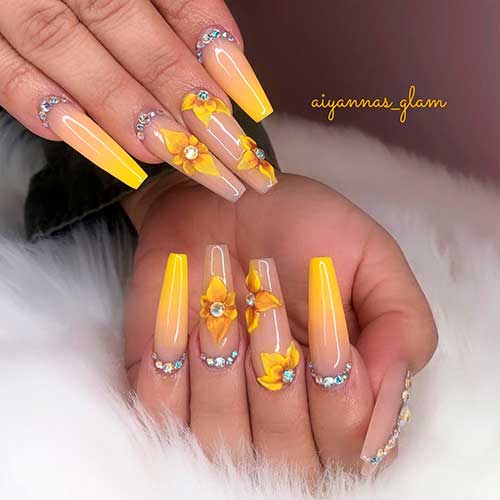 Glossy yellow ombre nails with rhinestones on nail base and 3d sunflowers on two accent nails!