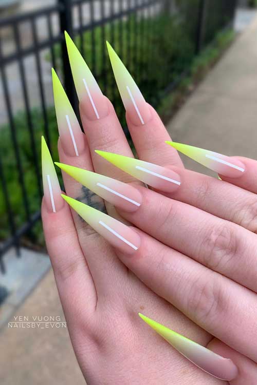 Lime ombre stiletto nails with a nude-to-lime gradient and white line accents, combining bold neon energy and elegance. Lime ombre stiletto nails with a nude-to-lime gradient and white line accents, combining bold neon energy and elegance.