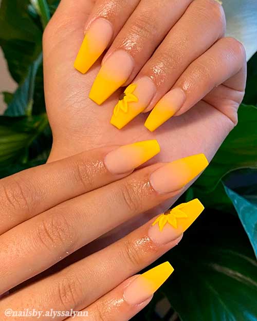 Matte coffin shaped yellow ombre nails with accent sunflower nail art Matte coffin shaped yellow ombre nails with accent sunflower nail art