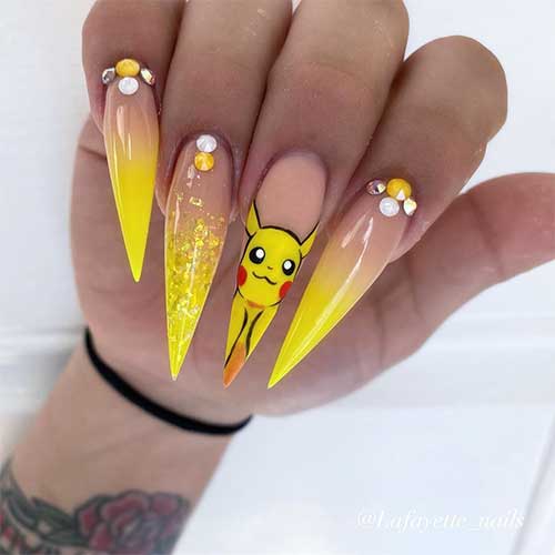 Yellow ombre stiletto nails 2020 with rhinestones, accent glitter nail, and second accent hand painted nail design Yellow ombre stiletto nails 2020 with rhinestones, accent glitter nail, and second accent hand painted nail design