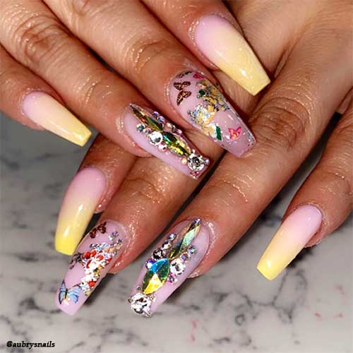 pink and yellow ombre nails coffin shaped with butterflies and rhinestones