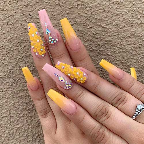 yellow ombre coffin nails long with rhinestones on two nails and 3d yellow flowers on accent nail