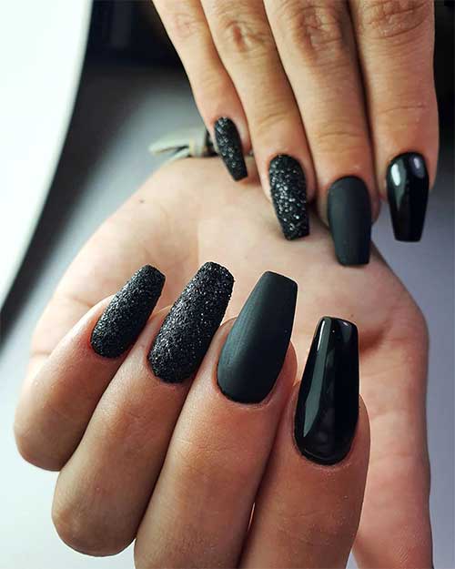 Coffin shaped black nails matte and glossy with two accent black glitter nails design Coffin shaped black nails matte and glossy with two accent black glitter nails design