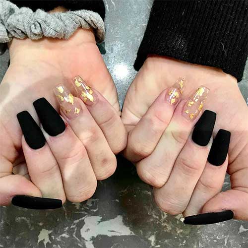 Cute black matte coffin nails with two accent gold foil clear nails design Cute black matte coffin nails with two accent gold foil clear nails design