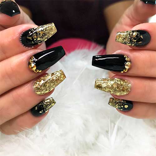 Cute gold glitter acrylic nails coffin shaped with some rhinestones on accent nail design