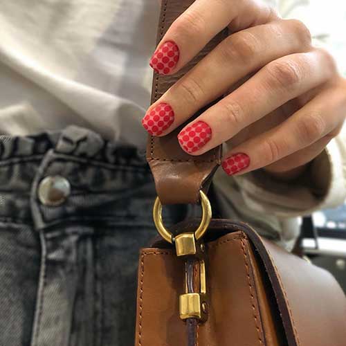 Cute red matte nails with design consists of red matte circles on short square nails set Cute red matte nails with design consists of red matte circles on short square nails set