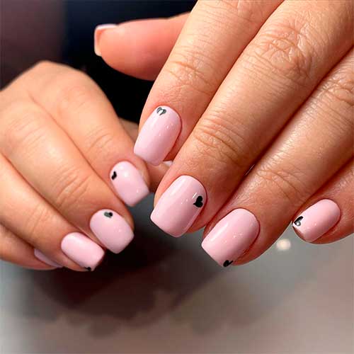 Cute short square pink acrylic nails with hearts on them