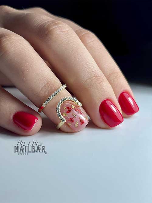 Glossy Short Red Nails with Tiny Flowers Glossy Short Red Nails with Tiny Flowers on A Nude Accent Nail Adorned with Gold Patches