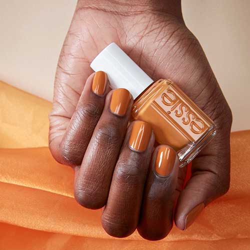 Kaf-tan essie nail polish for summer 2020 on dark skin hands