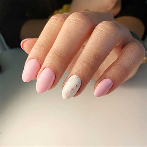 Light pink almond shaped nails with white marble accent nail