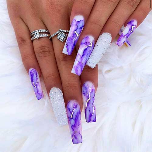 Cute purple and white marble nails squared shaped with accent white sugar glitter nail and some glod stripes design! Cute purple and white marble nails squared shaped with accent white sugar glitter nail and some glod stripes design!