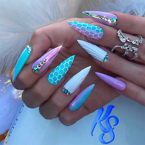 Gorgeous long stiletto mermaid nails with glitter and rhinestones design