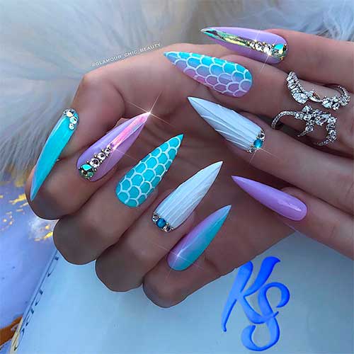 Gorgeous long stiletto mermaid nails with glitter and rhinestones design Gorgeous long stiletto mermaid nails with glitter and rhinestones design