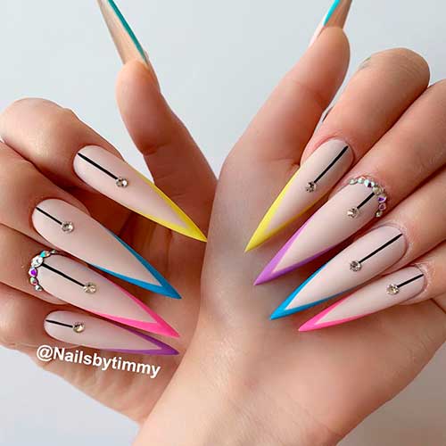 Bright colorful nails consists of stiletto V French nails with rhinestones design!