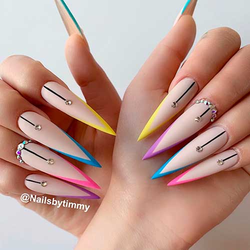 Bright colorful nails consists of stiletto V French nails with rhinestones design! Bright colorful nails consists of stiletto V French nails with rhinestones design!