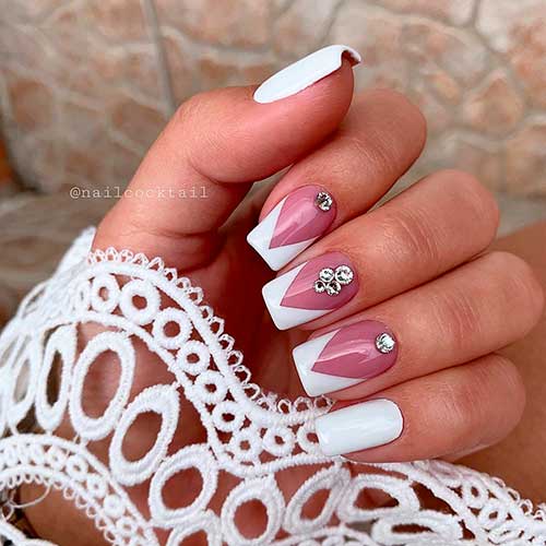 Cute white v french tip short nails with silver rhinestones, and two white square accent nails!