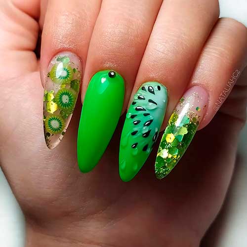 Gorgeous encapsulated fruit nails consist of almond shaped kiwi nails and accent glitter nails for summer season!