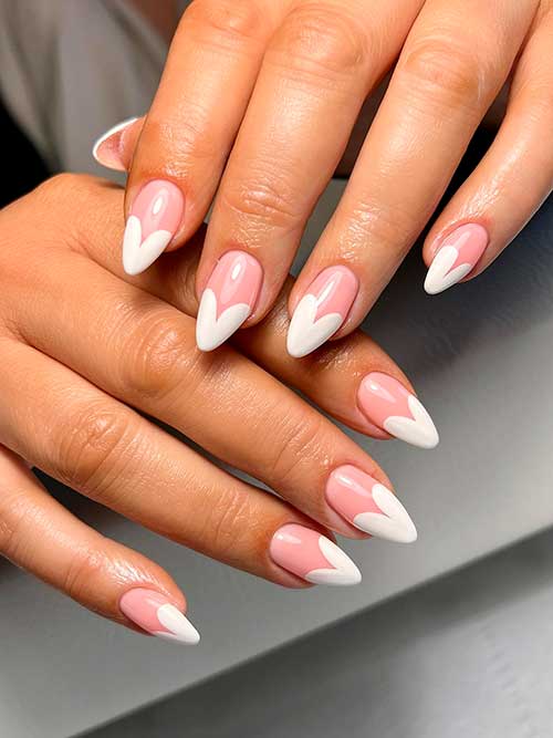 Long almond-shaped white heart-shaped French nails 2023 to celebrate Valentine’s Day