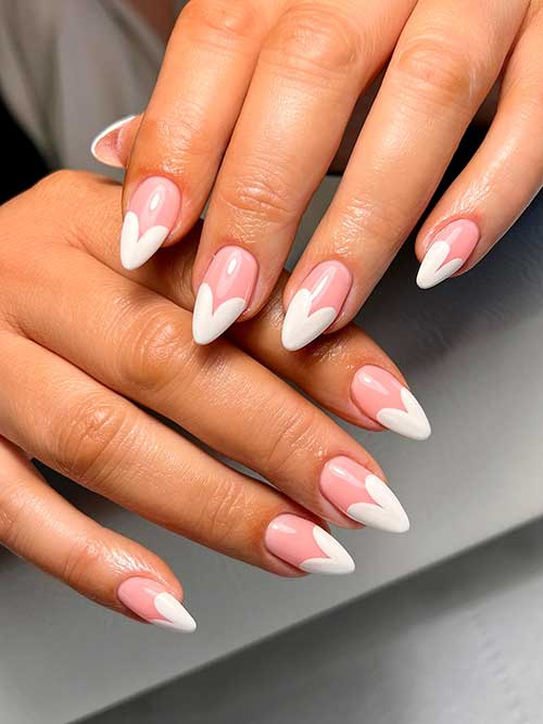 White Heart Shaped French Nails Long almond-shaped white heart-shaped French nails 2023 to celebrate Valentine’s Day