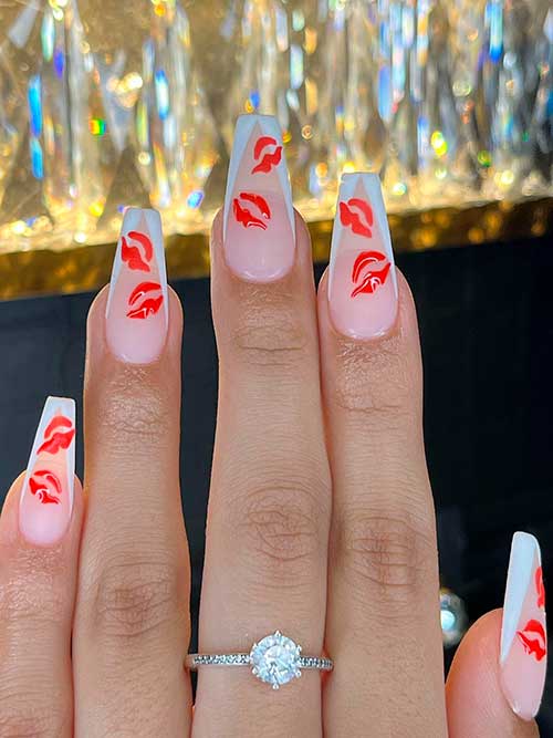 Long coffin-shaped white V French tip nails with red kiss lips to celebrate Valentine’s Day