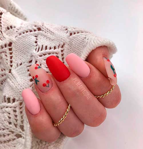 Pastel fruit nails design consists of squoval cherry blossom nails with two matte baby pink acrylic nails and matte red accent nail!