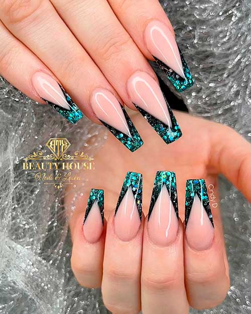 Perfect black v French coffin nails with teal glitter on tips Perfect black v French coffin nails with teal glitter on tips