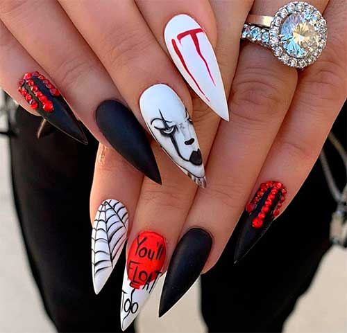 Amazing spooky nails consist of stiletto shaped IT nails 2020, accent spider web nail, and black nails with rhinestones, Halloween Nail Ideas