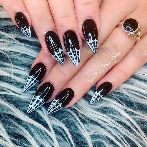 Black simple Halloween nails 2020 almond shaped idea that consists of black almond nails with white spider web on tips! Black simple Halloween spider web nails 2020 almond shaped idea that consists of black almond nails with white spider web on tips - Halloween Nail Ideas