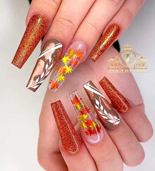 Cute burnt orange glitter fall nails coffin shaped long with fall leaves on accent clear nail and accent foil and leaf nail!