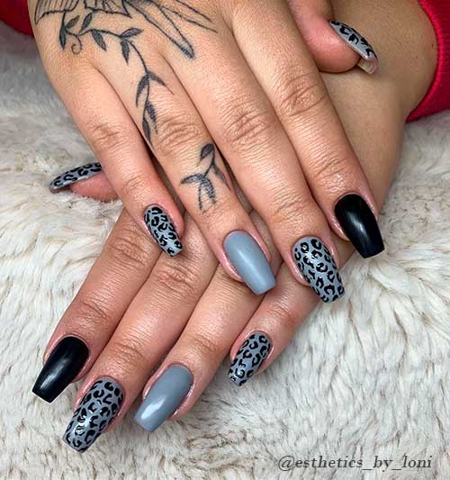 Glossy grey nails coffin shaped with cheetah animal print and accent black nail design! Glossy grey nails coffin shaped with cheetah animal print and accent black nail design!