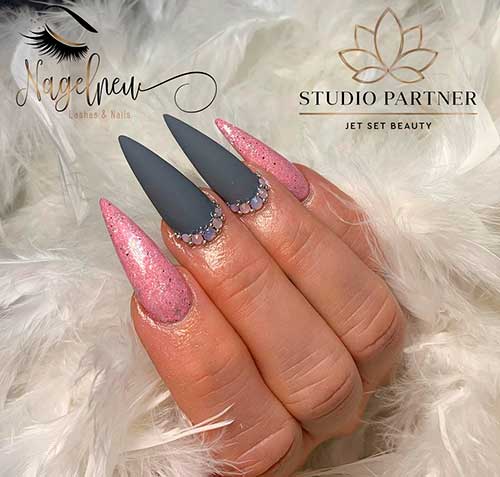 Grey stiletto nails adorned with rhinestones, with shimmery pink nails!