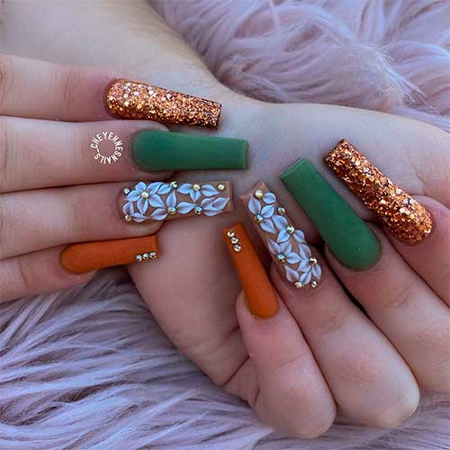 Long squared fall nails consist of gold glitter, burnt orange, nude, and matte olive green nails! Long squared fall nails consist of gold glitter, burnt orange, nude, and matte olive green nails!