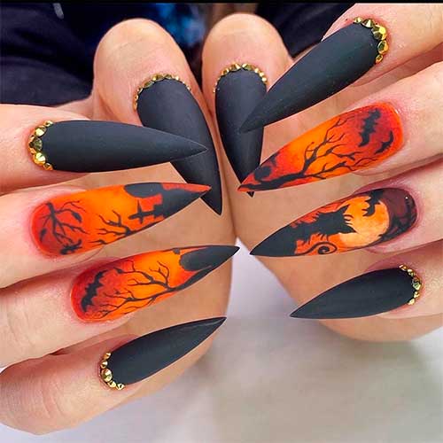 Matte black Halloween themed nails stiletto shaped with two accent Halloween Gothic stiletto nails 2020 design - Halloween Nail Ideas