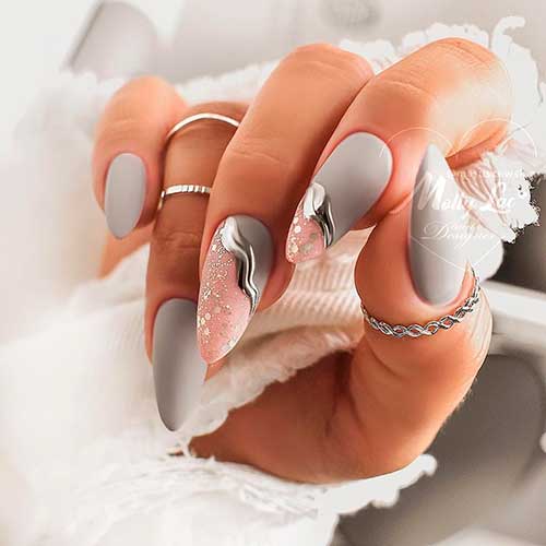 Matte grey and pink almond shaped nails with silver glitter design! Matte grey and pink almond shaped nails with silver glitter design!