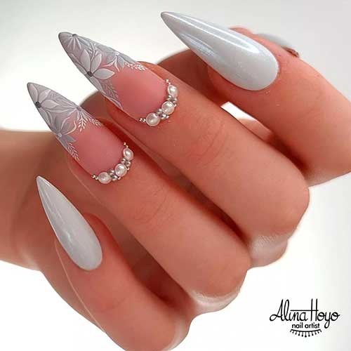 Shimmer grey stiletto nails design with rhinestones, and stunning hand painted flower nails tips on two accent nails Shimmer grey stiletto nails design with rhinestones, and stunning hand painted flower nails tips on two accent nails