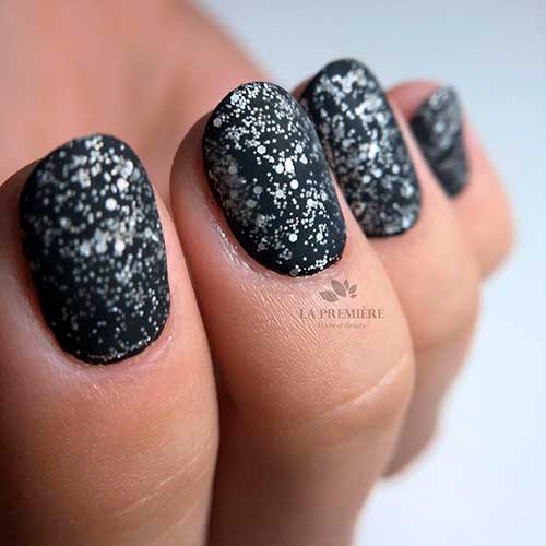 Short matte black nails 2020 with silver glitter idea