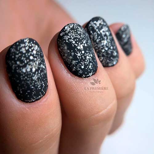 Short matt black nails 2020 with silver glitter idea Short matte black nails 2020 with silver glitter idea