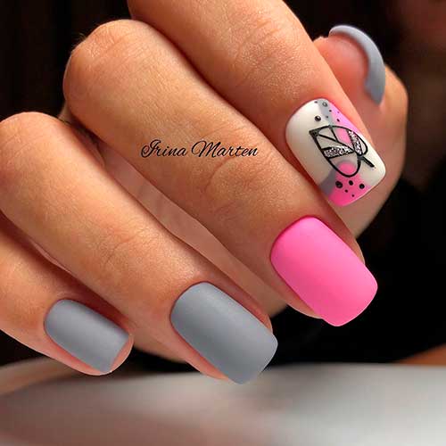 Short matte grey nails complemented by pink and white accent nails, creating a stylish and modern manicure.
