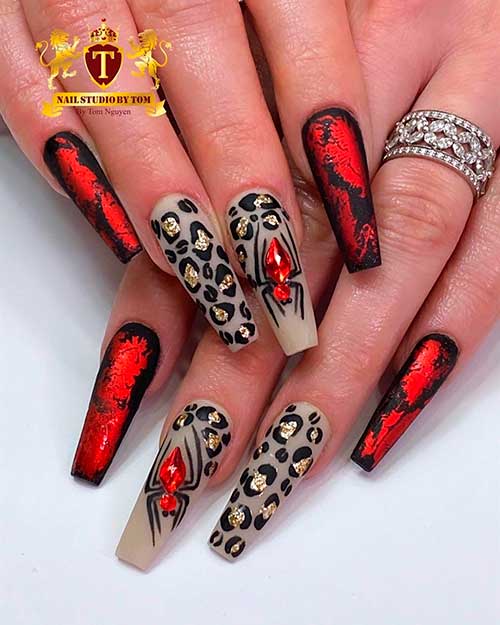Unique nails consists of leopard print nails, accent spider nail, and black coffin nails with blood nail art idea - Halloween Nail Ideas